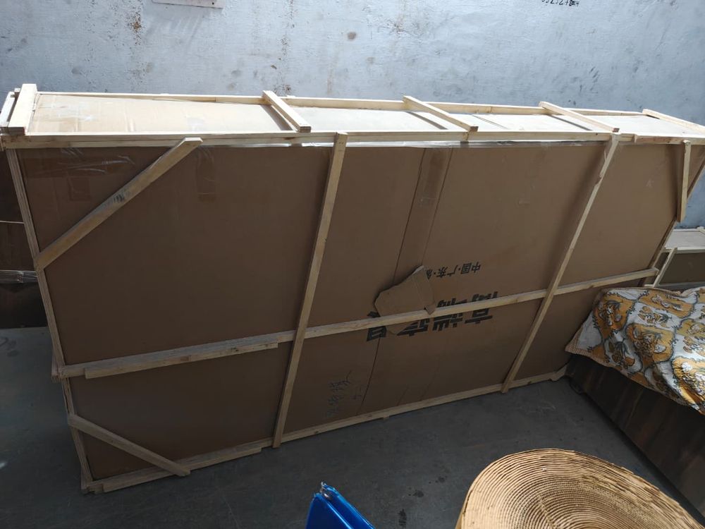 Large item strapped and crated for transit