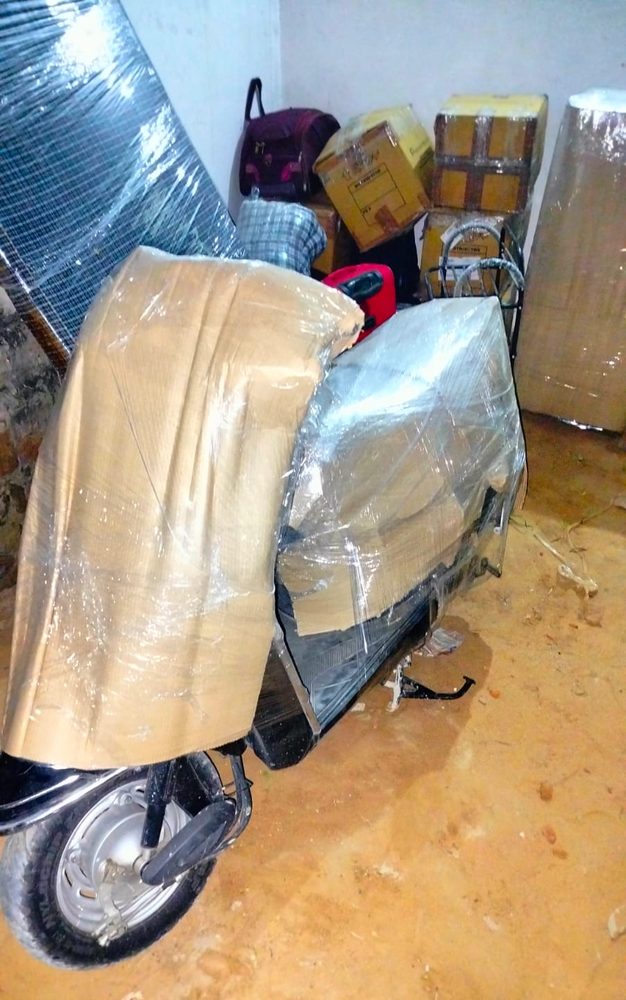Two-wheeler wrapped and prepared for transport